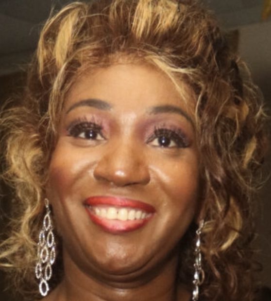 Smiling woman with curly blonde hair